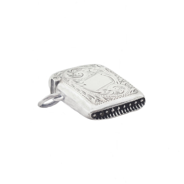 A scroll leaf small rounded vesta case in sterling silver dated 1906